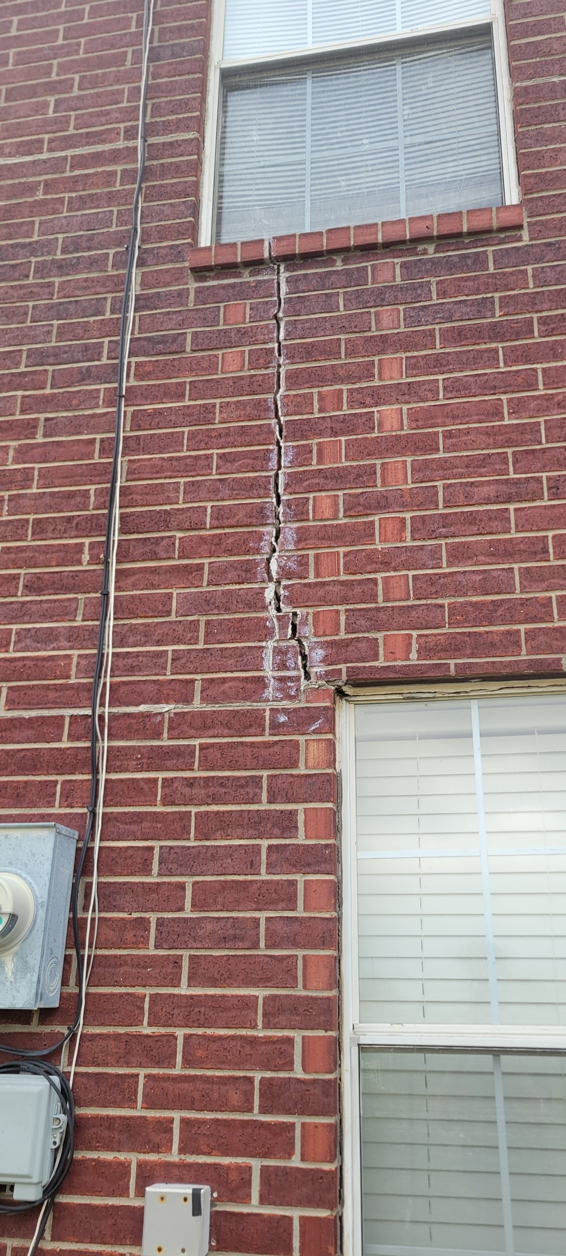 Cracked brick above window